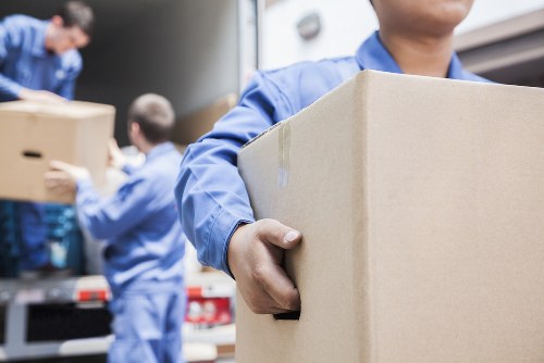 Moving team handling boxes safely in St Johns Wood