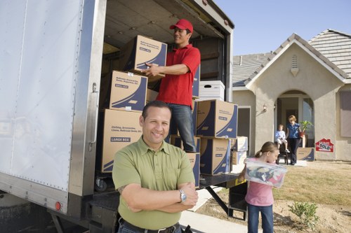 Loading fragile items into a moving truck for a Stjohnswood move