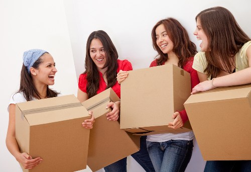 Business relocation team packing office equipment
