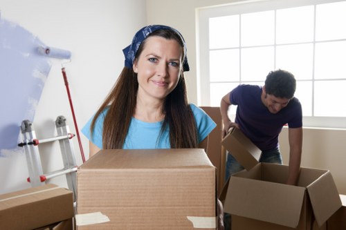 Worker assessing moving risks before handling household items