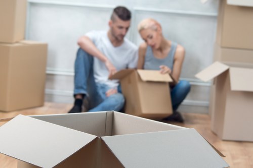 Professional movers packing and loading household items in Stjohnswood