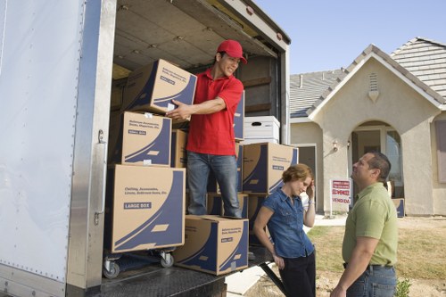 Careful unloading with protective materials around furniture