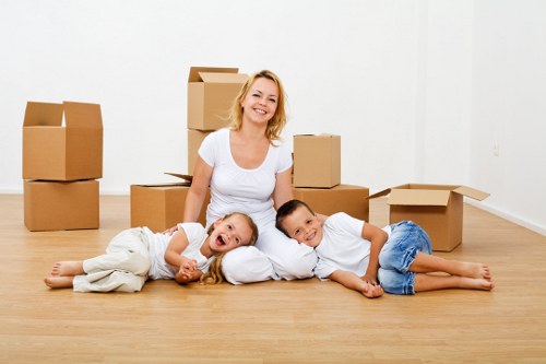 Packed moving boxes ready for transport in Stjohnswood