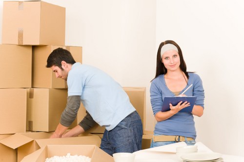 Careful wrapping and boxing of fragile belongings during a local move