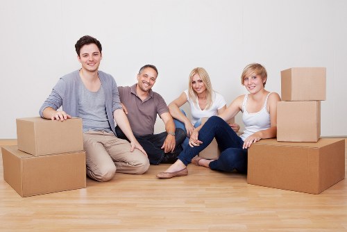 Boxes and furniture being unloaded during a student relocation in St Johns Wood