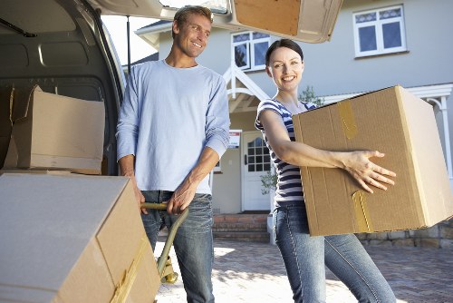 Professional movers handling furniture near St Johns Wood apartments